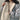 Women's black oversized puffer bomber jacket with a trendy and modern design, featuring a padded collar and long sleeves, styled to provide a warm and fashionable look for winter.