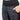 A woman wearing black quilted thermal skinny pants and a grey sweater, holding a bag in one hand.