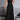 Women's black sleeveless wide-leg spandex jumpsuit with a fitted waist and scoop neck, suitable for urban summer style.