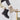 Women's black suede ankle boots with fur lining, designed for winter wear, shown on a person's feet. The boots feature a non-slip sole, suitable for cold and icy conditions, and are paired with casual winter attire.