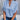 Women's black v-neck blouse with split sleeves, styled as an elegant summer work top.