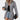 Women's black and white houndstooth blazer with tartan pattern, featuring long sleeves and a tailored fit, styled with a dress shirt underneath, suitable for office wear.