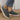 Women's blue denim sneakers featuring cat embroidery, designed as casual slip-ons.