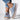 Women's blue denim sneakers with cat embroidery, depicted as casual slip-on shoes.