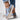 Women's blue denim sneakers with cat embroidery, casual slip-on style.
