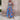 Women's blue floral wide-leg jumpsuit featuring a one-piece design with sleeveless arms, shoulders, and a round neck, ideal for resort fashion.