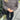 Women's brown corduroy oversized jacket displayed on a mannequin, emphasizing its trendy casual urban style with distinctive shoulder and sleeve features. The jacket is paired with a black dress shirt underneath, showcasing a fashionable layering option.