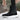 Women's brown waterproof insulated high-top snow boots displayed on a model, showcasing their stylish design suitable for snowy conditions.