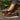 Women's brown wedge loafers styled as casual sneakers, featuring a sleek design with a comfortable wedge heel.