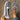 Women's brown wedge loafers worn with blue jeans, showing a stylish and casual look.