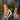 Women's brown wedge loafers displayed on a clean surface, showcasing their stylish design and casual sneaker appearance.