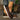 Women's brown wedge loafers styled as casual sneakers, featuring a sleek design with a comfortable wedge heel, suitable for everyday wear.