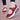 Women's burgundy mesh Mary Jane sneakers with comfortable air cushion, shown on a model's foot wearing a white dress, highlighting the shoe's purple hue and textile material.