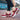 Women's burgundy mesh Mary Jane sneakers with comfortable air cushion design being worn, showcasing their stylish and supportive fit.