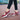 Women's burgundy mesh Mary Jane sneakers with comfortable air cushion, highlighting the stylish design and breathable material, showcased on a model's foot.