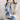 A cozy blue and white striped turtleneck sweater designed for women, perfect for winter wear, with a focus on the neck and shoulder area.