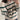 Women's cream and burgundy striped puff sleeve sweater, showcasing the shoulder and sleeve design, ideal for autumn wear.