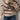 Women's cream and burgundy striped puff sleeve sweater, featuring a stylish autumn knitwear design with a round neck and comfortable fit on the shoulders and arms.