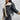 Women's cropped beige leather jacket with a cozy fleece collar, featuring long sleeves and a fitted waist design.