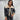 Women's cropped beige leather jacket with a fleece collar, featuring long sleeves and a stylish design. The jacket highlights a fashionable fit around the waist, suitable for modern outerwear styles.