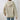 Women's grey fur-lined cable-knit hoodie with long sleeves and a cozy woolen texture, perfect for winter wear.