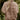 Women's gray lightweight quilted jacket with long sleeves, featuring a stylish design ideal for fall weather, displayed in a natural outdoor setting.