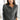 Women's gray wool button-up V-neck cardigan, casual chic office sweater, displayed on a mannequin, showcasing its long sleeves and tailored fit.