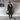 Women's gray wool knee-length coat featuring a stylish collar and waist detail, perfect for urban fashion. The coat is paired with shoes, highlighting the full look.