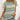 Women's green and blue striped t-shirt with short sleeves, modeled by a woman.