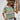 Woman wearing a green and blue striped short sleeve t-shirt, styled casually for summer.