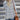 Women's grey plaid fleece sweater with a cozy high neck pullover design, featuring long sleeves and a tartan pattern.