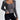 Women's grey ribbed long sleeve crop top with a square neckline, showcasing the garment's sleek and stylish design.