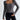 Women's grey ribbed long sleeve crop top with a square neckline, highlighting the arm and waist areas, set against a contrasting background.