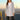 Women's grey waterproof hooded raincoat, featuring a lightweight and urban style design with a standing collar and long sleeves.