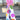 Women's High-Waisted Floral Print Wide-Leg Summer Trousers in white and purple, modeled outdoors with a pink shoulder bag and a hat.