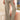 Women's high-waisted light gray linen palazzo pants, featuring a relaxed fit and summer fashion style, with visible waist and thigh areas.