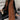 A women's long brown suede vest designed for fall fashion, featuring a sleeveless style and layered look.