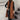 A stylish women's long brown suede vest designed for fall fashion, featuring a sleeveless cut and a flattering fit that accentuates the waist.