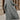 A stylish women's long grey coat featuring urban chic fall fashion design with tailored shoulders, a defined waist, and long sleeves crafted from high-quality textile.