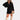 A woman wearing a long-sleeve black shirt dress with a casual and versatile design, featuring a mini dress length. She is accessorized with sunglasses and has her hair styled simply.