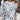Women's long sleeve blouse with a multicolor leaf pattern, featuring fall fashion design elements in a combination of white, black, and blue. The blouse highlights details such as a classic neckline and comfortable fit around the shoulders and sleeves.