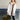 Women's luxury white puffer jacket with fur hood, featuring long sleeves and a plush, warm design suitable for winter.