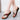 Women's multicolor wedge sandals, open toe slip-on, pink fashion footwear on a model's leg.