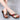 Women's multicolor wedge sandals with an open toe design and slip-on style, featuring a comfortable fit.