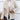 Women's off-white textured fleece jacket with a faux fur collar, featuring long sleeves and a stylish design.