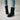 Women's orange suede ankle boots with sherpa lining and chunky heels, showcasing a stylish fashion accessory perfect for pairing with denim outfits.