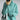 Oversized black cashmere turtleneck knit sweater for women in a turquoise color, featuring long sleeves and a relaxed fit.