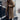 Women's oversized blue teddy coat made of warm faux sheepskin, featuring long sleeves, a wide collar, and a knee-length design.