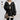 Women's oversized cable knit sweater in a chunky layered design, featuring a grey color with long sleeves and a high neckline, perfect for winter fashion.