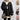 Oversized women's cable knit sweater in a chunky, layered design, featuring long sleeves and a cozy neckline, ideal for winter fashion in black and white tones.